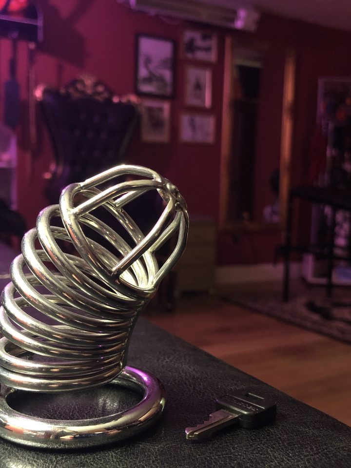 Steel chastity device on display in the dungeon suite
