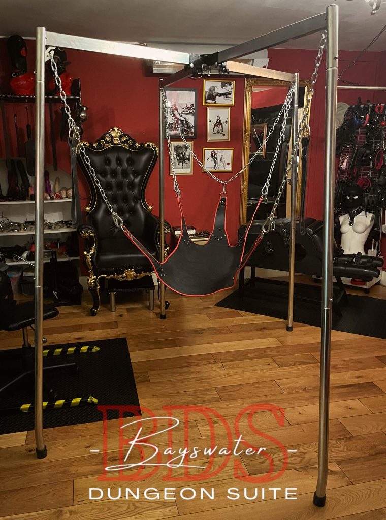 Leather sling hanging in its steel frame in front of the throne